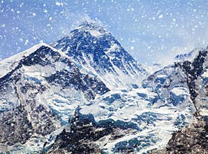 View of top of Mount Everest with clouds and snowfall