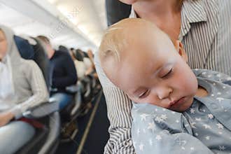 Mother with baby in plane