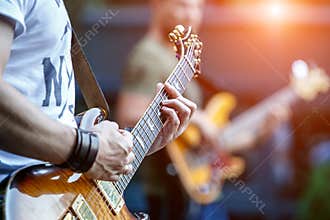 Guitarist playing live concert with rock band