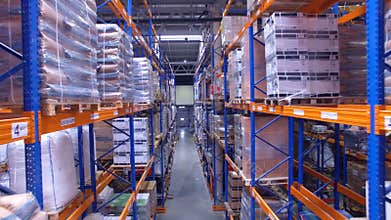 Warehouse storage interior. Aerial camera moving along shelfs, racks.