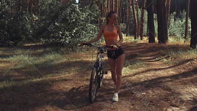 Young girl with a Bicycle