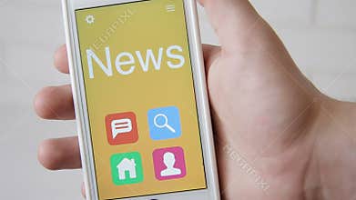 News concept application on the smartphone. Man uses mobile app.