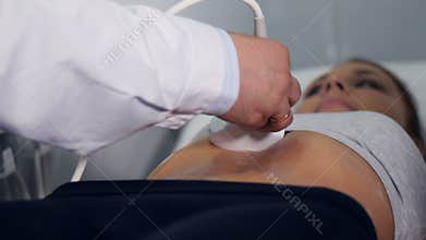 Close up of the doctor making the ultrasound examination of the abdominal cavity. 4K.