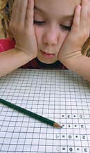 School girl in problems with math