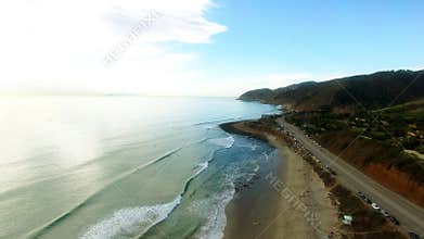 Beautiful Pacific ocean coast and a highway nearby