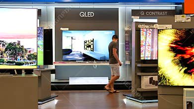 Motion of shopper looking new TV to buy