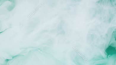 Turquoise and white ink in water