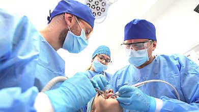 Dentist Doctor and his Team Treating a Patient
