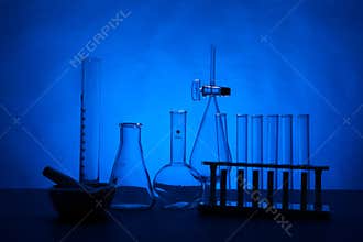 Chemistry lab set on a table over blue background