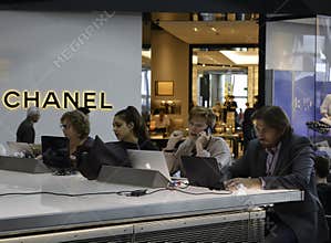 Heathrow airport - people working on Laptops