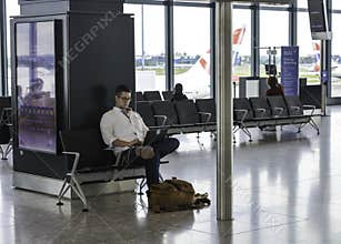 Heathrow airport - man working on his laptop