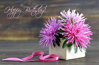 Happy Birthday card with flowers arranged in gift box