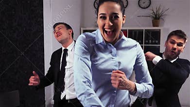 Crazy happy businessmen and businesswoman dancing in office