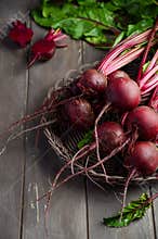 Bunch of fresh organic beets on rustic wooden table