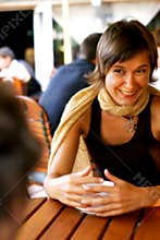 Woman enjoying conversation at coffee