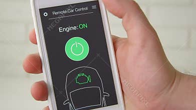 Man remotely starts engine of his car. Car remote control using smartphone application fictional interface.