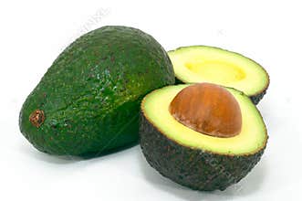 Green Avocado with cut ripe