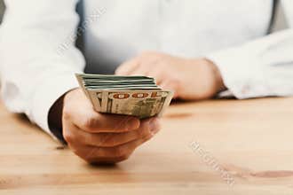 Man in shirt giving of money. Loan, finance, salary, bribe and donate concept.