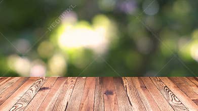 Perspective wood and bokeh light background. product display template. Wood table top on blur moving natural green leaf