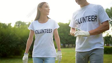 Two volunteers walking around and having chat