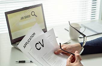 Job seeker in home office. Motivated applicant. Modern job hunting, seeking and employment. Man reading his cv or curriculum vitae