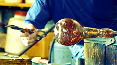 Glassworker in action in the Murano, Italy, glass factory