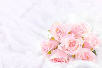 Pastel Coloured Artificial Pink Rose on white fur background