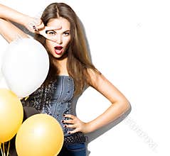 Beautiful fashion model girl with colorful balloons