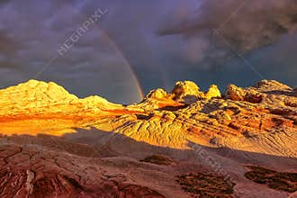 Rainbow over the Plateau White Pocket during sunset