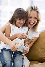 Woman and young girl in living room