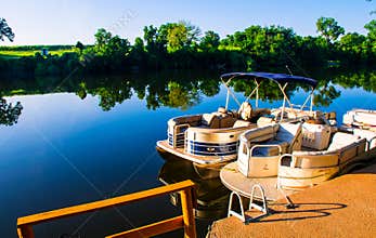 Lake LBJ reflections Pontoon boats on the water Docked Ready for open water