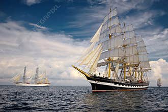 Sailing ships on the background of a very beautiful sky. Sailing. Luxury yacht.