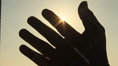 Hand and sun