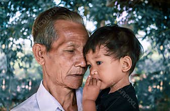 Very old man and two years old baby.