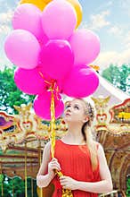 Young model woman with bright balloons