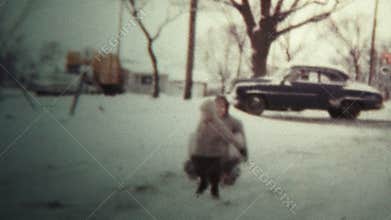 1958 - Kid Pulling Dad Around On Snow Sled