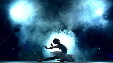 Ballerina doing a workout on blue, slow motion