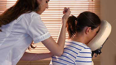 Woman enjoying a chair massage