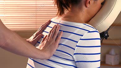 Woman enjoying a chair massage