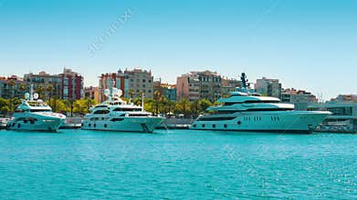BARCELONA, CATALUNYA, SPAIN Luxury yachts in port establishing shot