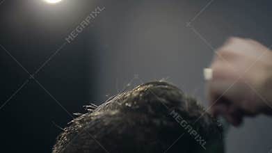 Barber Cuts the Hair in the Barbershop. Slow Motion. Close Up
