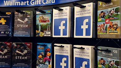 Woman picking the facebook game gift card