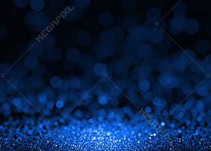 Blue sparkle glitter abstract background.