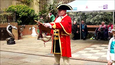 Town crier anounces the news