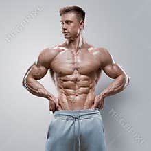 Handsome power athletic young man with great physique