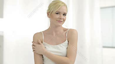 Woman applying deodorant
