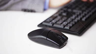 Close up of male hand with keyboard and mouse