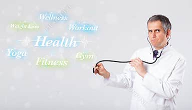 Clinical doctor pointing to health and fitness collection of words