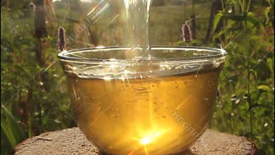 Play of light in stream of honey.