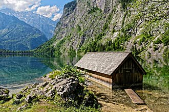 Old boathouse in scenic alpine landscape